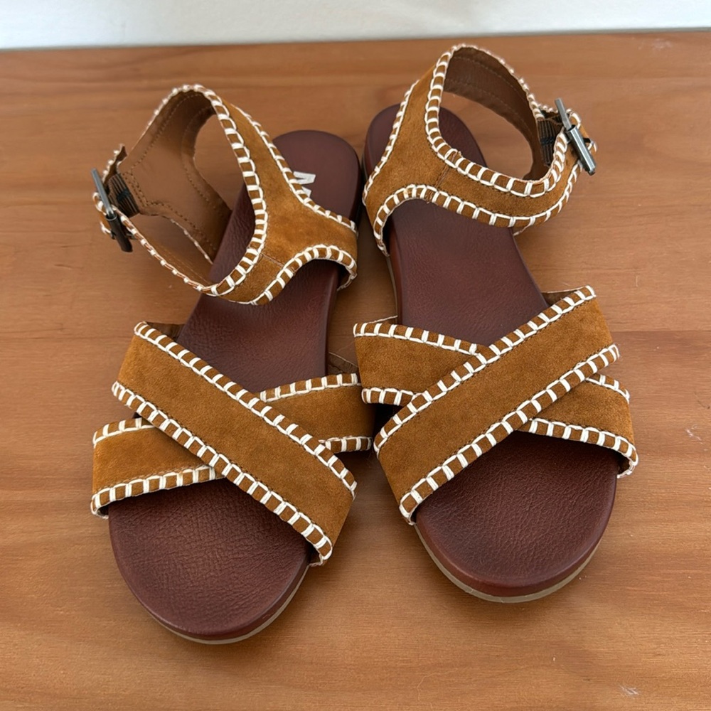 Brown and white stitched sandals